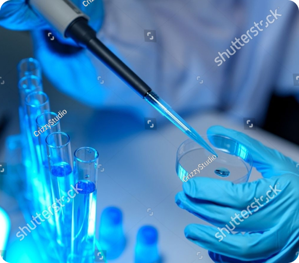 Researcher pipetting a sample into a petri dish under blue laboratory lighting
