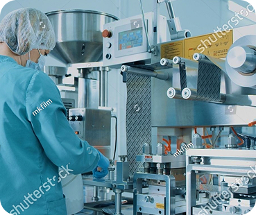 Operator working at a pharmaceutical filling machine